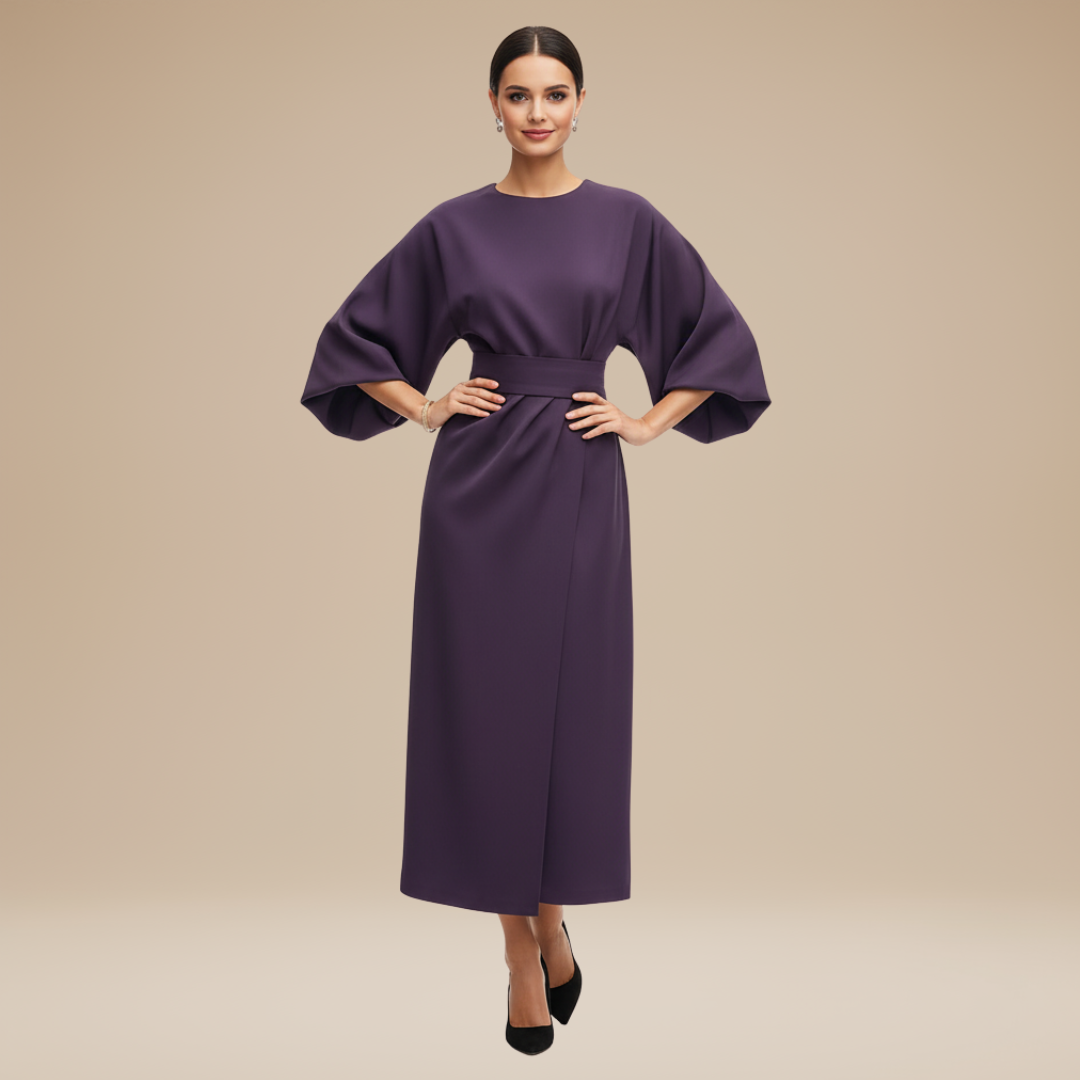 Woman wearing a midi dress with wrap front and soft sleeve shape on a plain background.
