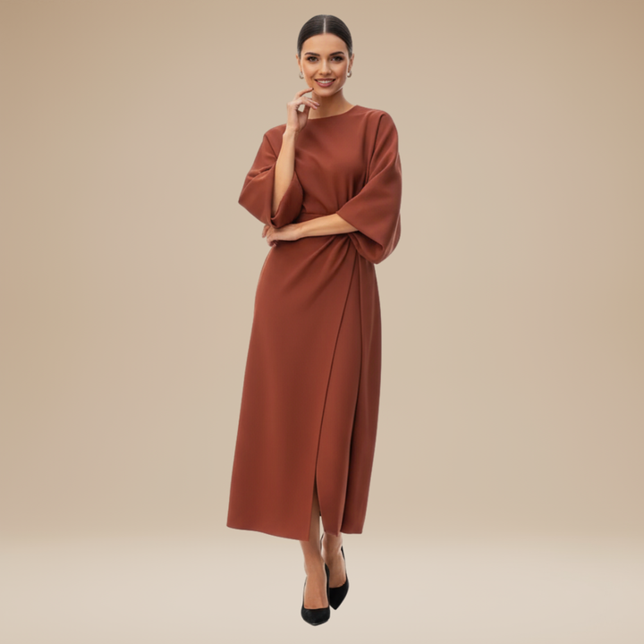 Female model showcasing a wrap midi dress with waist-defining belt on a plain background.