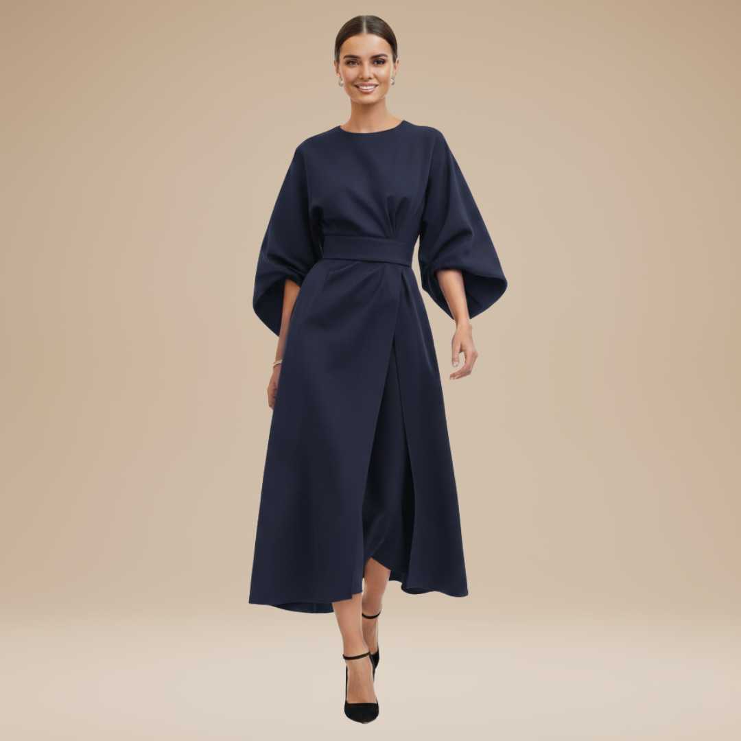 Woman in a wrap midi dress with draped waist detail and wide sleeves on a plain background.