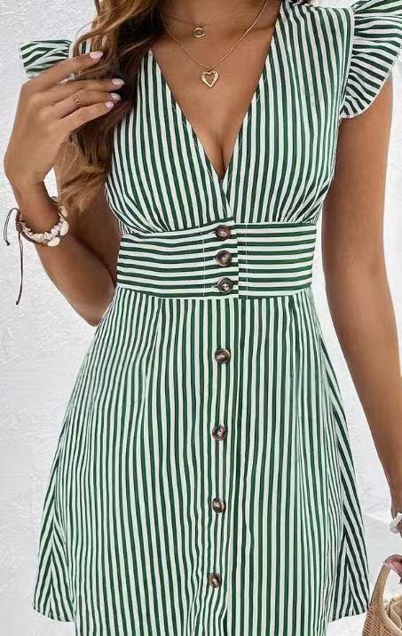 Model showcasing a feminine V-neck dress with button-front accents on a clean background.