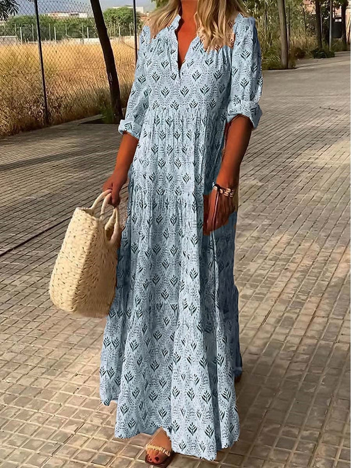 Model wearing a flowing fabric maxi dress with a flattering V-neckline.