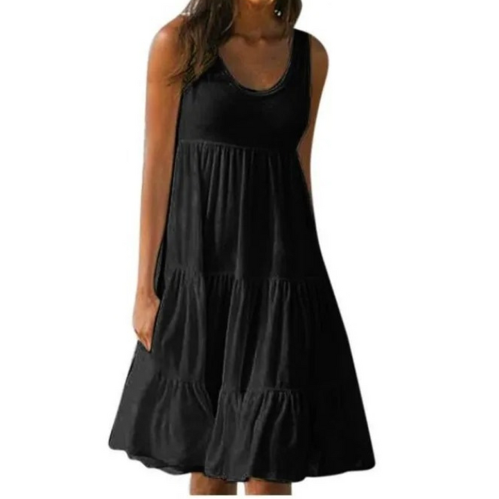 Flowy ruffle midi dress with scoop neckline shown on a plain background.
