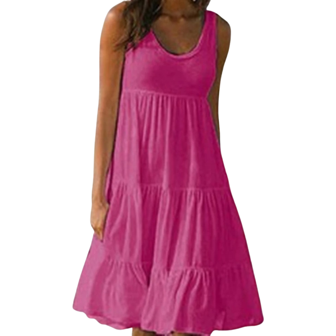Breezy midi dress with flowing ruffle tiers shown on a plain background.