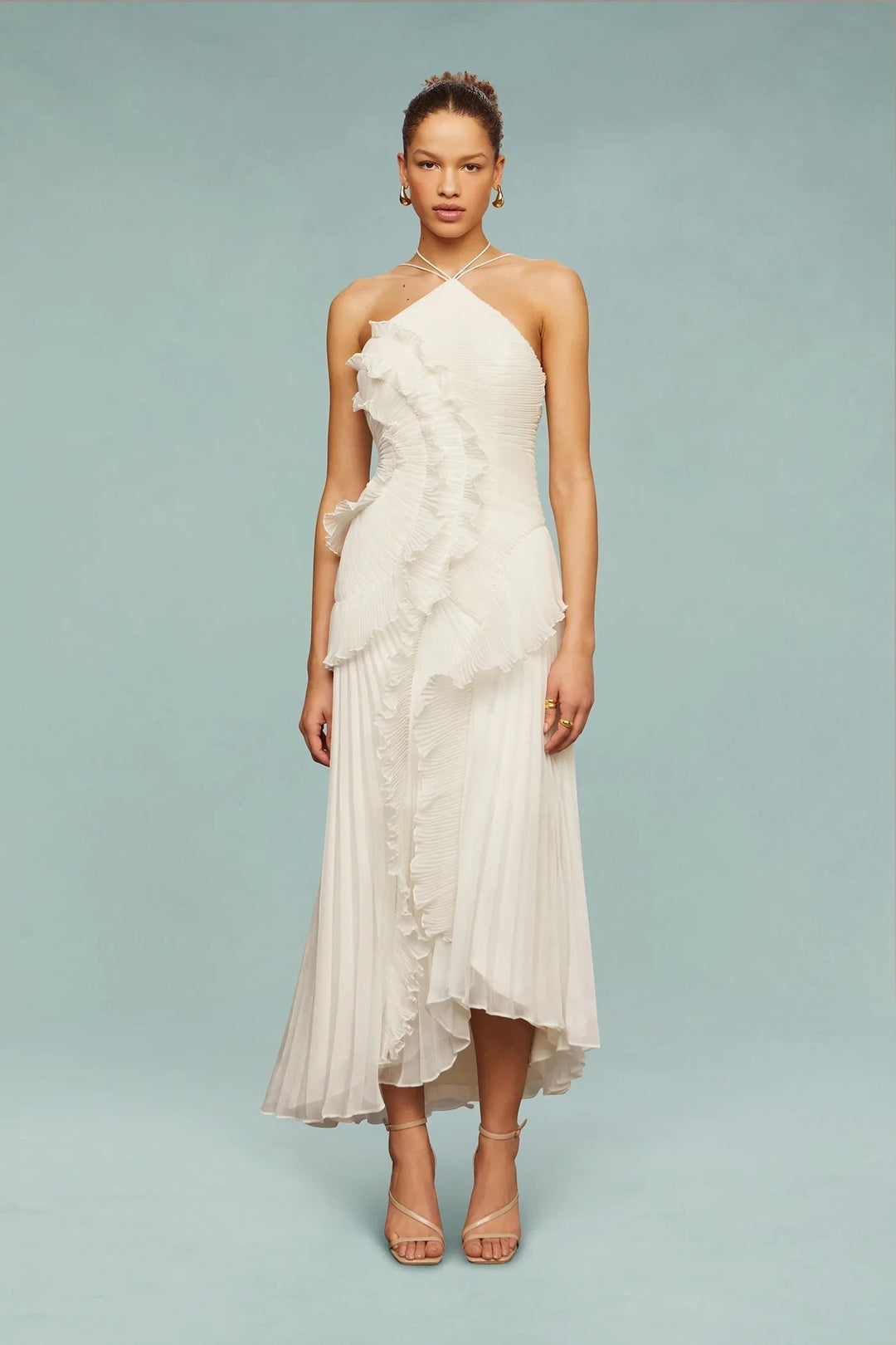Female model posing front view in flowing ruffle maxi dress.