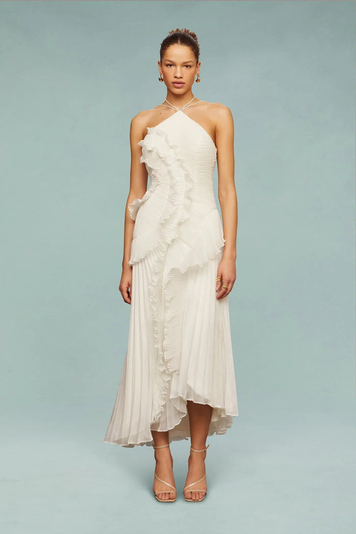 Female model posing front view in flowing ruffle maxi dress.