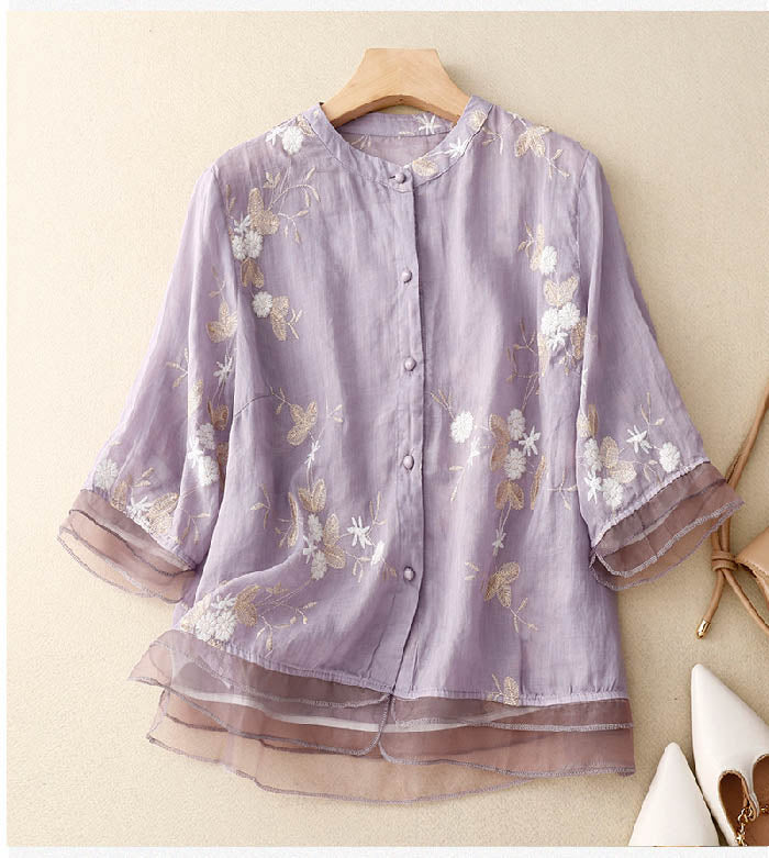 Relaxed fit embroidered blouse shown against a clean background.