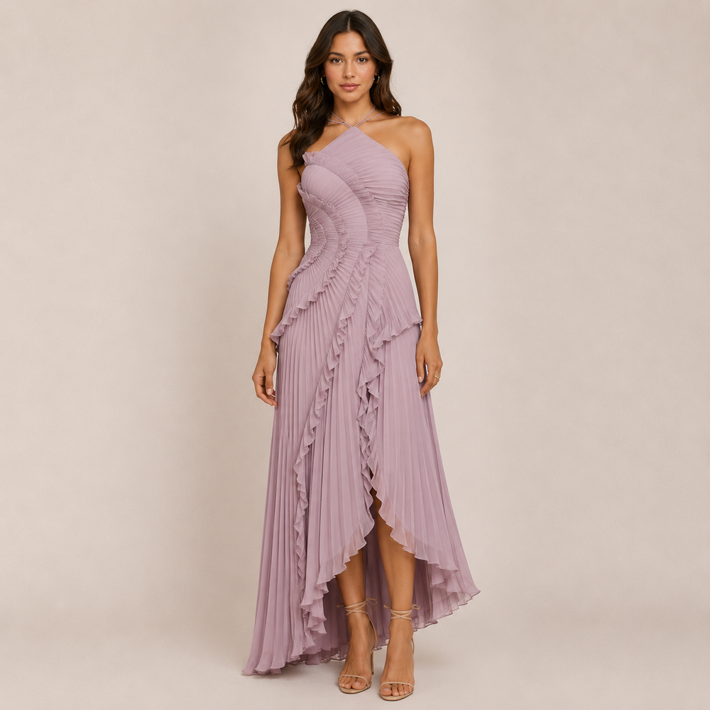 Female model wearing a flowing ruffle halter dress on a plain background.