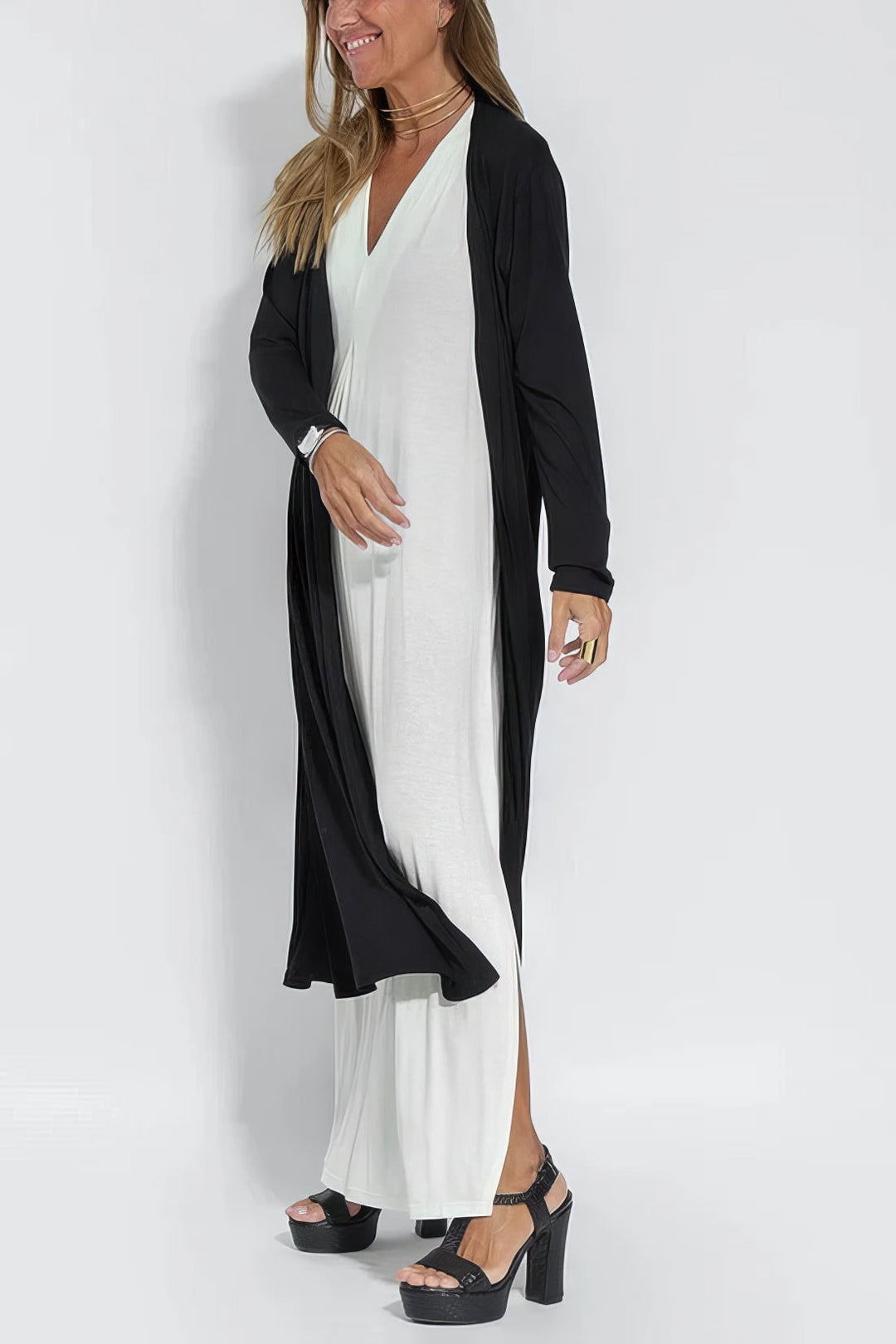 Lightweight flowing dress w/ model on a clean background, offering soft comfort and poise