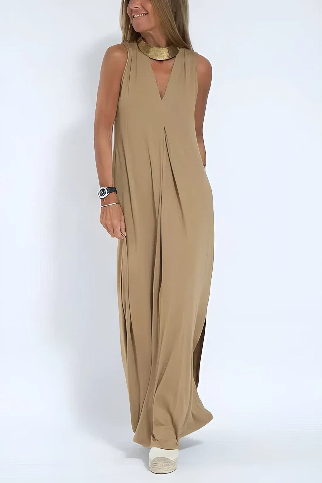 Flowing women’s long dress w/ model on a clean background, designed for graceful movement.