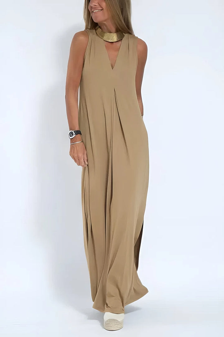 Flowing women’s long dress w/ model on a clean background, designed for graceful movement.