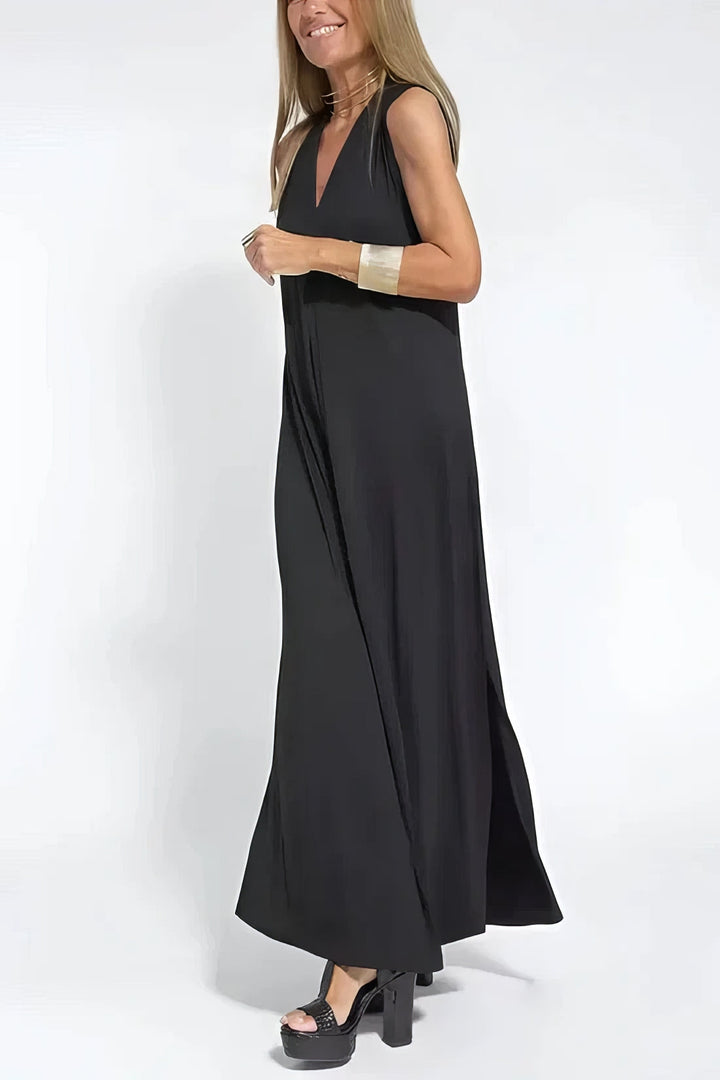 Elegant women’s dress w/ model on a clean background, featuring a gently shaped neckline.