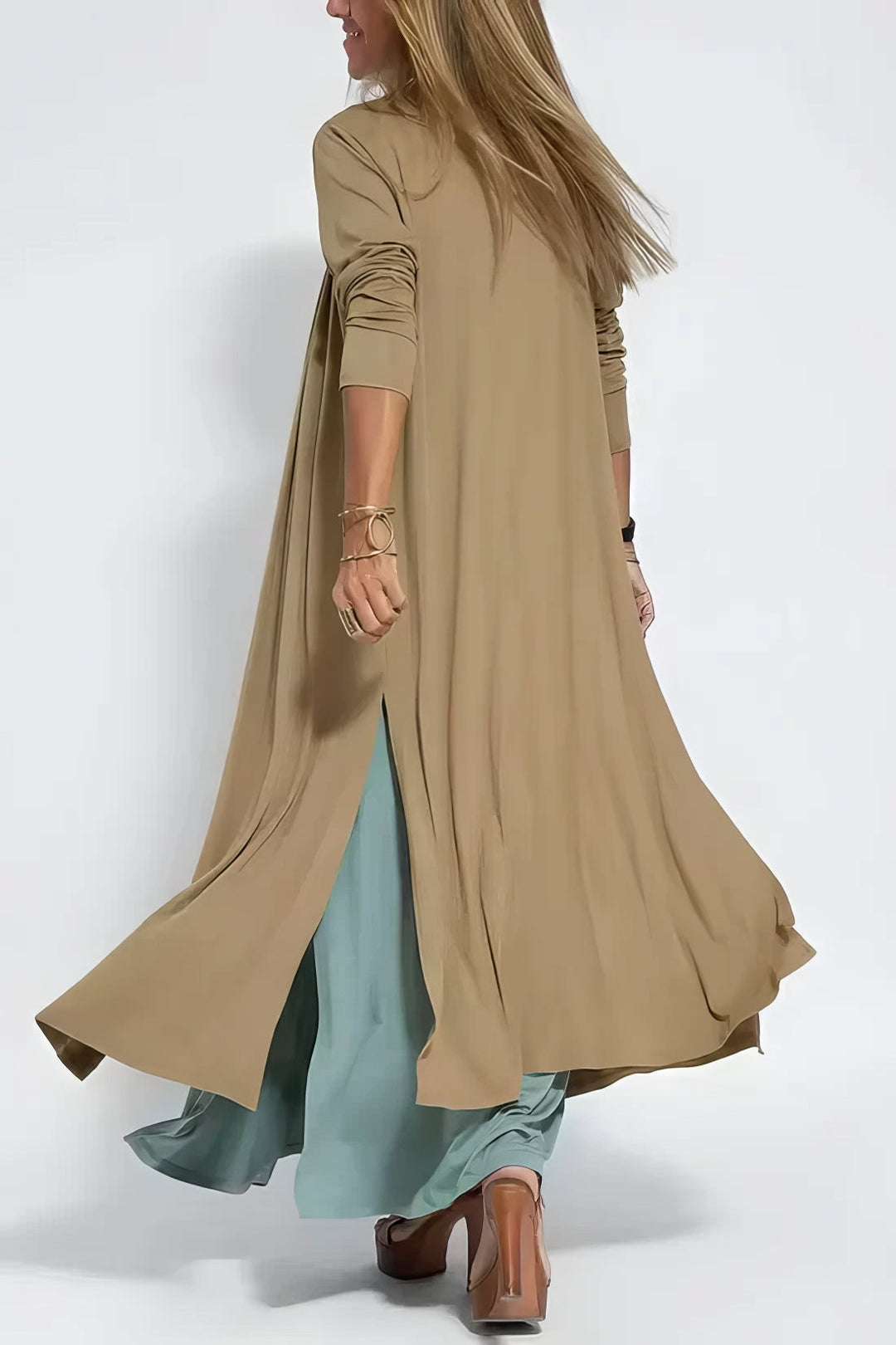 Long elegant dress w/ model on a clean background, made to flatter with gentle movement., back angle