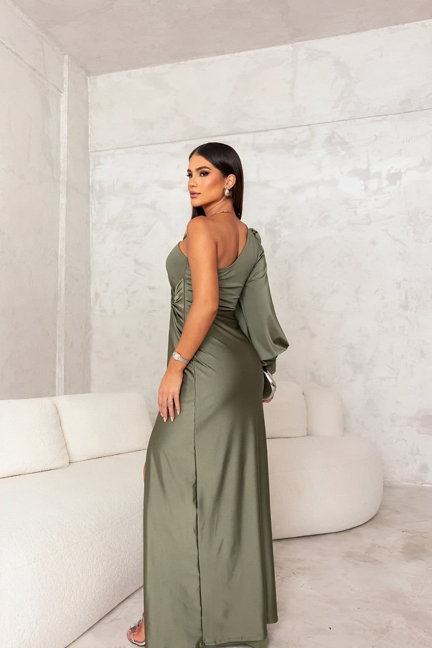 Woman in a sleeveless corset-style maxi dress on a plain background.