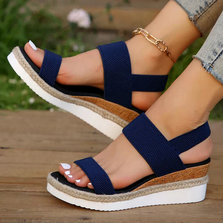 Adjustable strap sandals with contoured comfort footbed on a clean background.